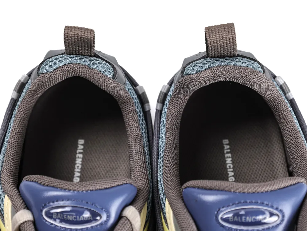 Gray and blue sneakers with mesh and fabric material, view of the inner soles.