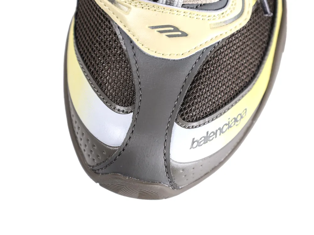 Brown mesh shoe upper with black leather accents and yellow detailing.