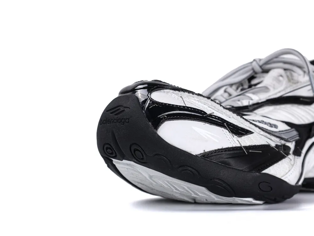 White and black sneaker toe detail with rubber sole and mesh material.