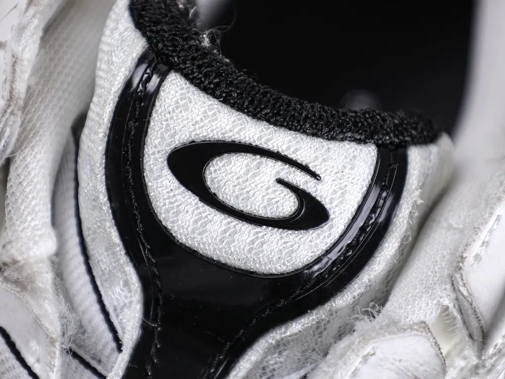 White fabric sneaker with black trim and logo detailing on the tongue.