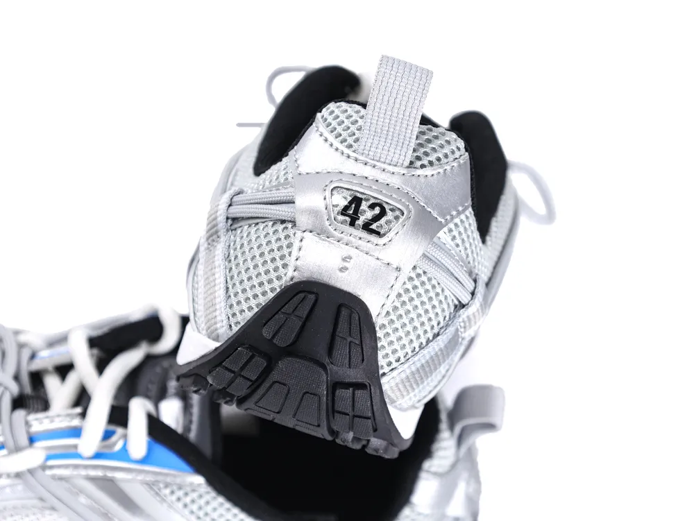 Silver mesh sneaker with black rubber sole and embroidered number 42 detail.