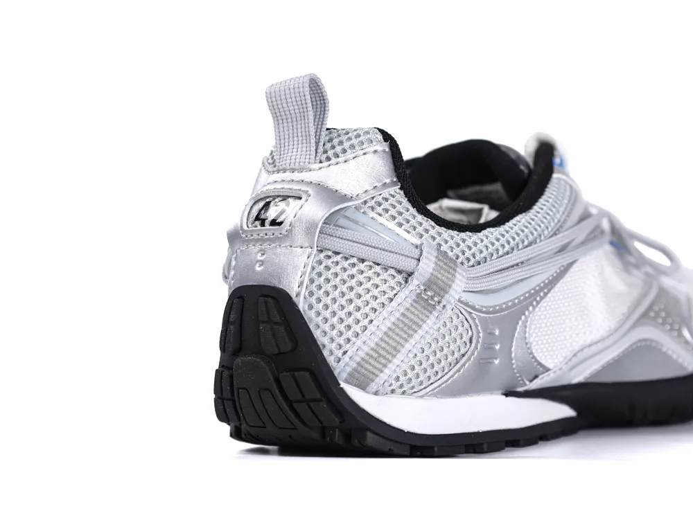 Silver and grey sneaker with mesh material and black rubber sole, side view.