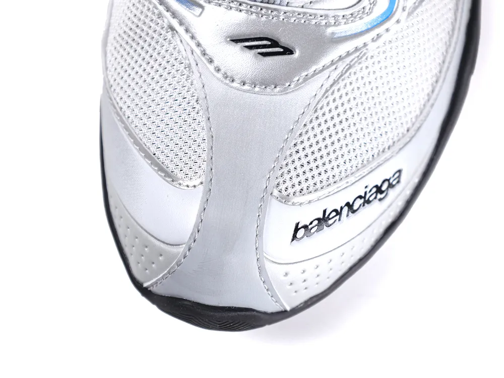 Silver and black shoe with mesh upper and leather accents, close-up view.