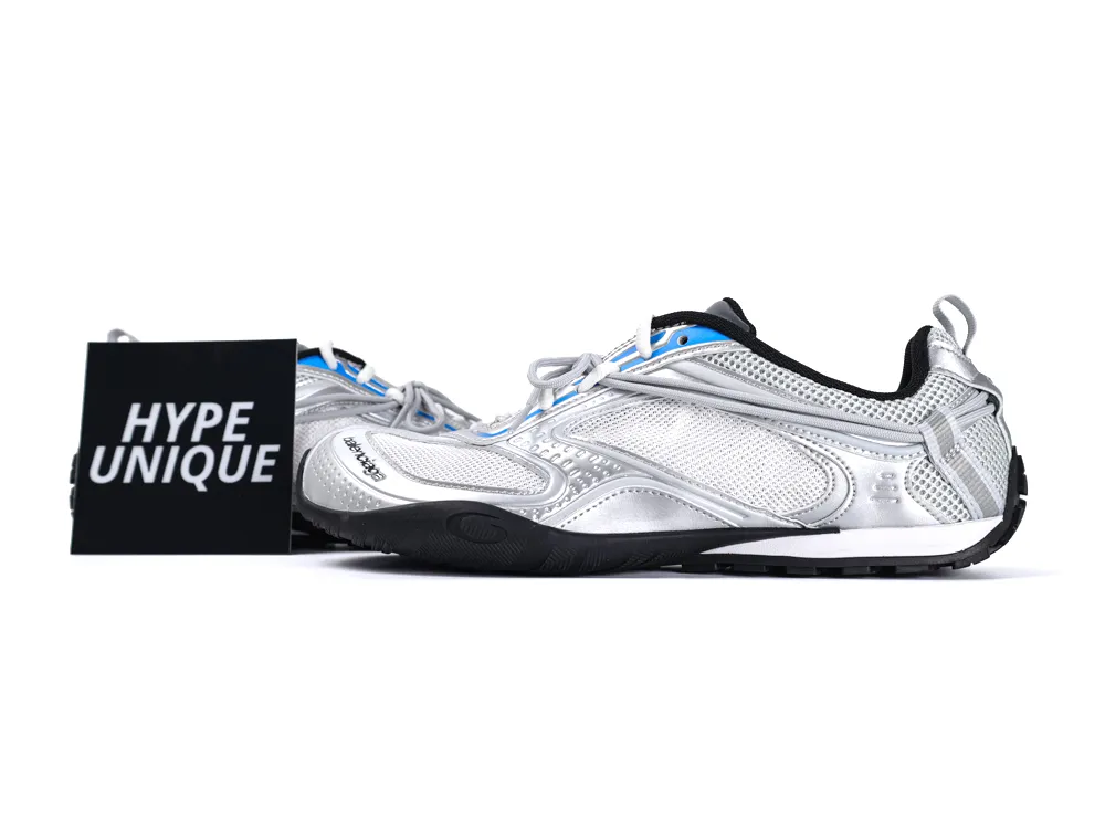 Silver mesh sneakers with metallic accents and rubber sole, displayed next to "Hype Unique" sign.
