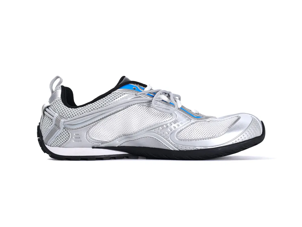 Silver sneaker with mesh and synthetic materials, featuring a black sole and blue accents.