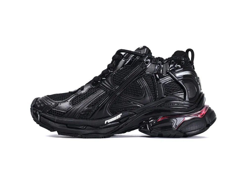 Black, glossy sneaker with mesh sections, featuring rubber sole and detailed design elements.