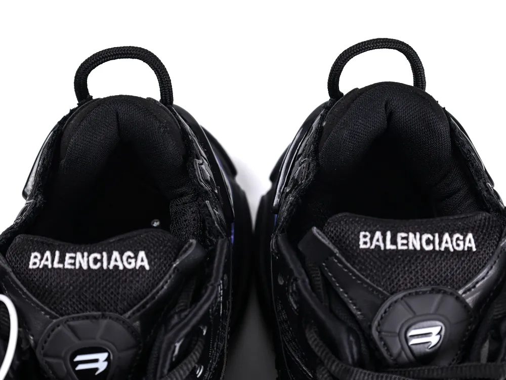 Black sneakers with mesh upper, featuring brand logo on the tongue area.