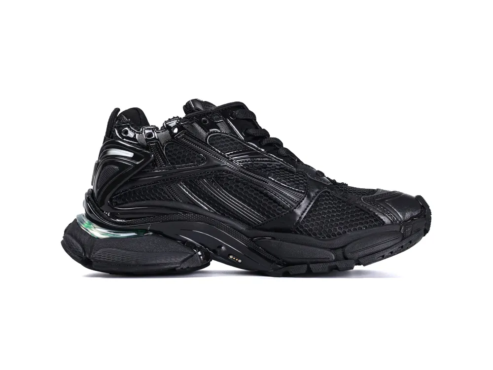 Black mesh and leather sneaker with a textured sole and detailed design.