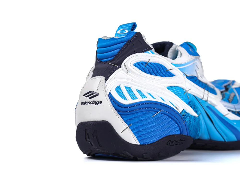 Blue and white sneaker with textile and leather material, featuring logo on heel.