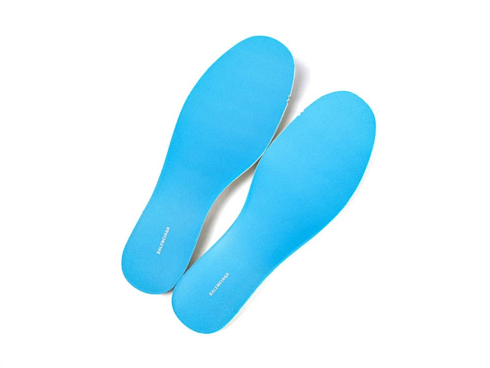 Bright blue foam insoles, textured surface, providing comfort and support.