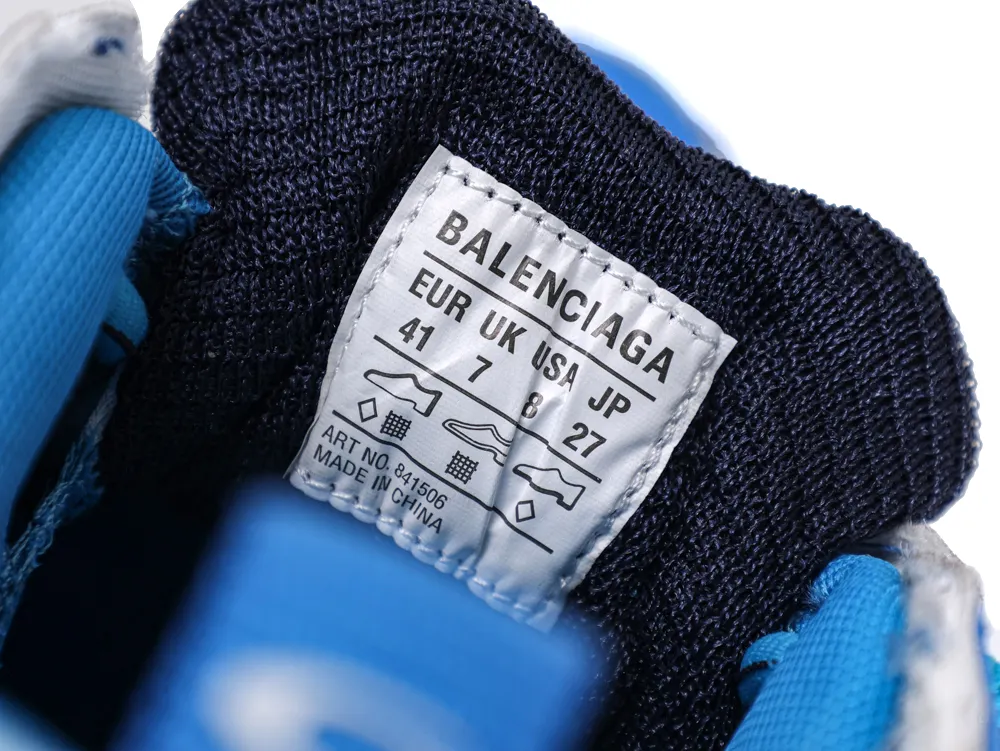 Close-up of a blue and black textile sneaker tongue with a white size label.