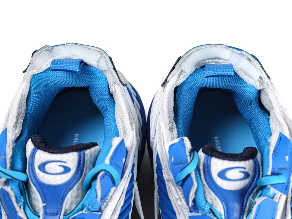 Bright blue foam insoles, textured surface, providing comfort and support.