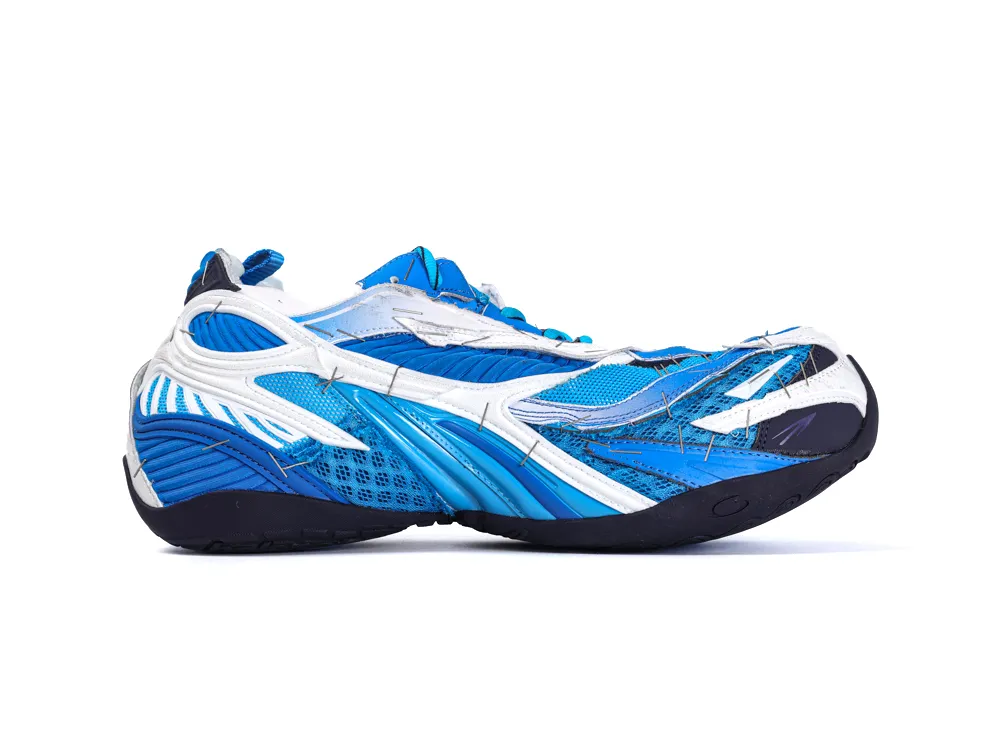 Blue and white sneaker with mesh and synthetic materials, featuring detailed stitching.