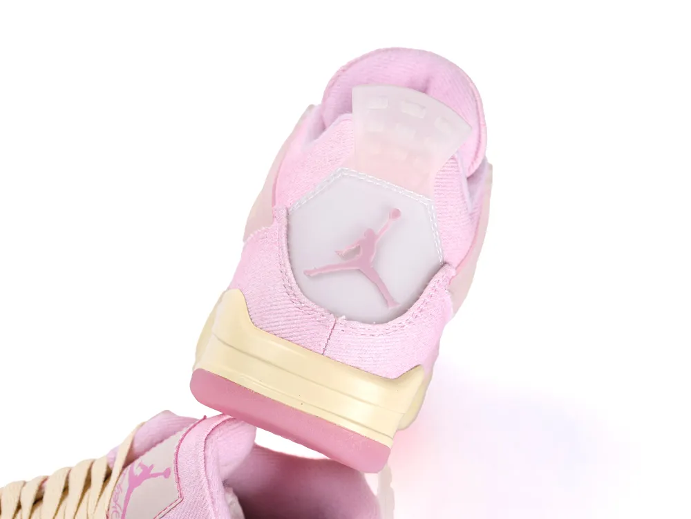 Pink fabric sneaker with cream sole and translucent logo detail on the heel.