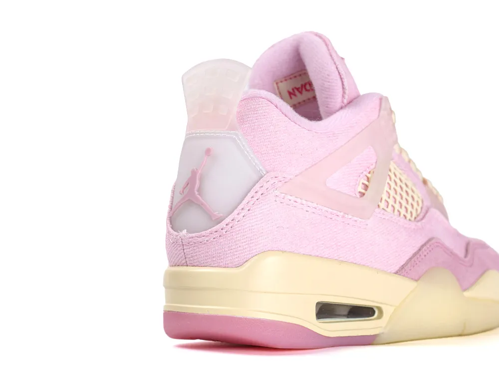 Pink fabric sneaker with white plastic logo detail and cream sole.