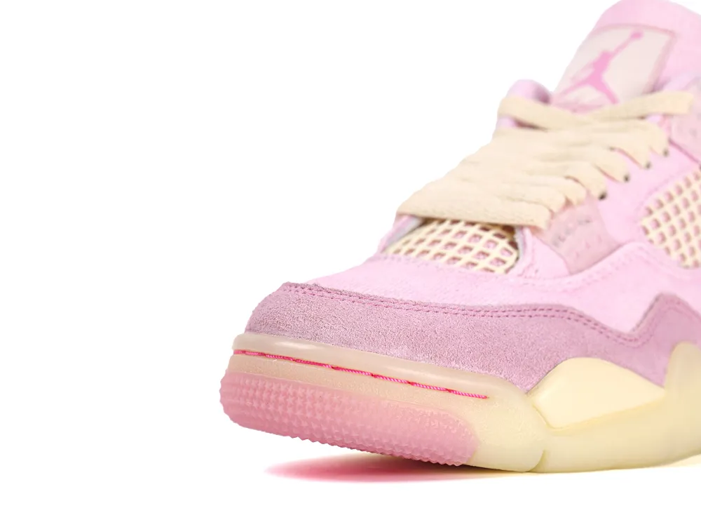 Pink suede sneaker with mesh panels and cream laces, featuring a pink rubber sole.