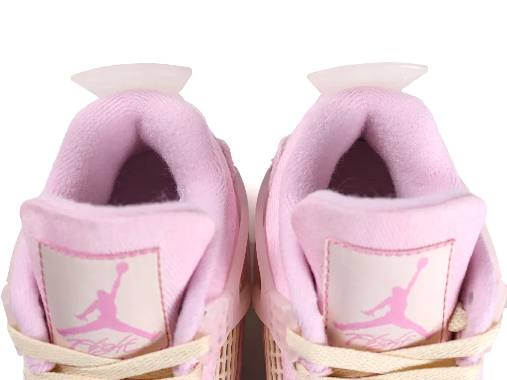 Pink fabric sneaker tongues with embroidered logos and white lace-up detail.