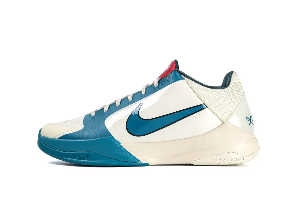 Blue and white athletic shoe with a synthetic upper and rubber sole.