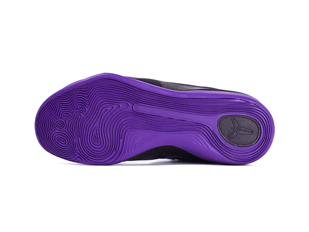 Purple rubber shoe sole with textured patterns and black heel logo detail.