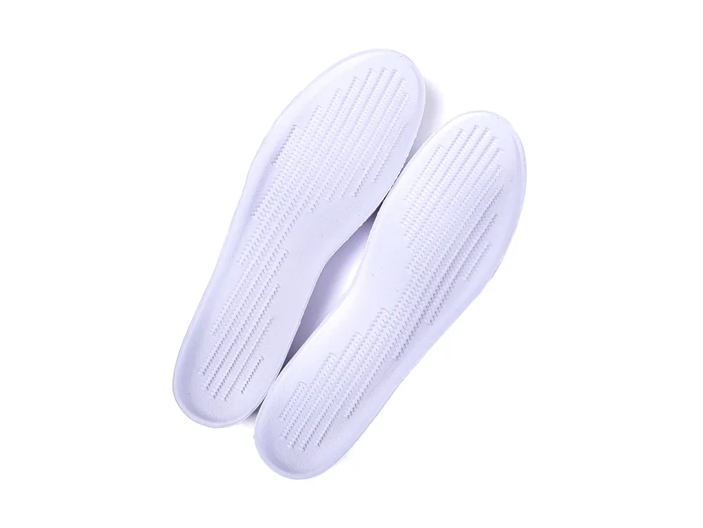 White foam shoe insoles with textured surface for enhanced comfort and support.