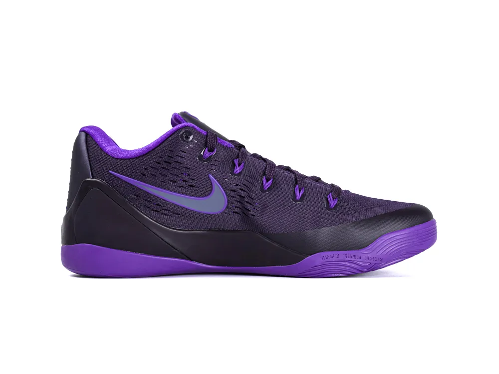 Purple and black athletic shoe with mesh upper and rubber sole.