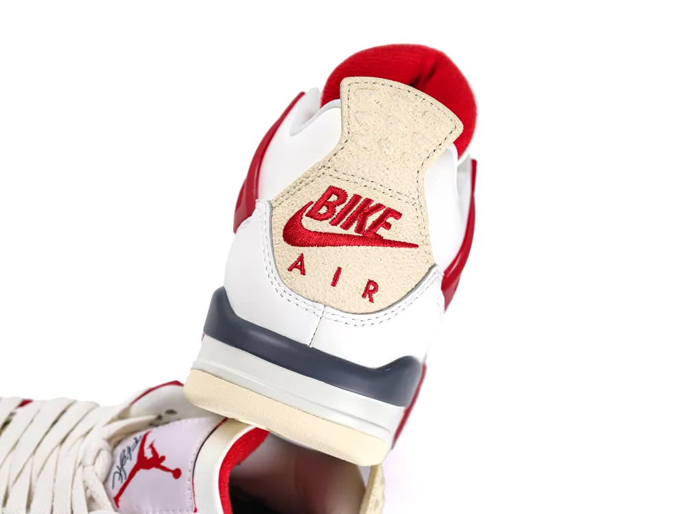 Red, white, and beige sneaker heel, leather and suede materials, visible logo.