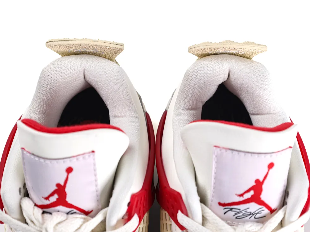 White and red fabric sneakers with padded collars and visible tongue logos.