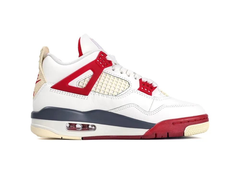 White, red, and beige leather sneaker with mesh panel and rubber sole detail.