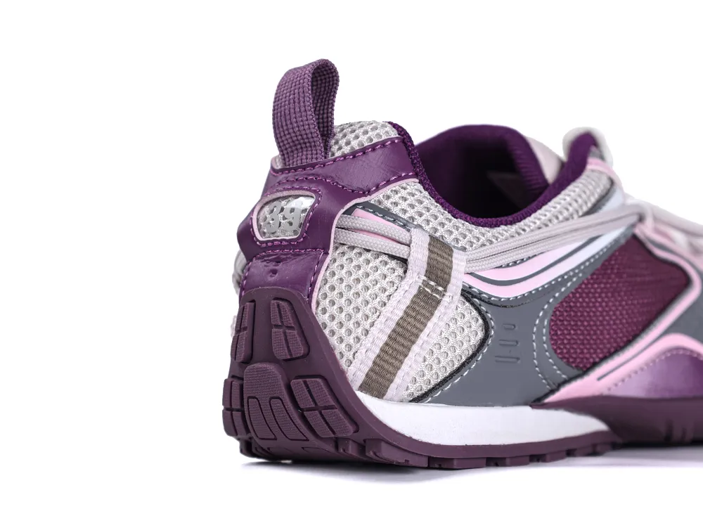 Close-up of the textured heel on a purple mesh Balenciaga Radar sneaker featuring a purple pull tab and thin rubber outsole.