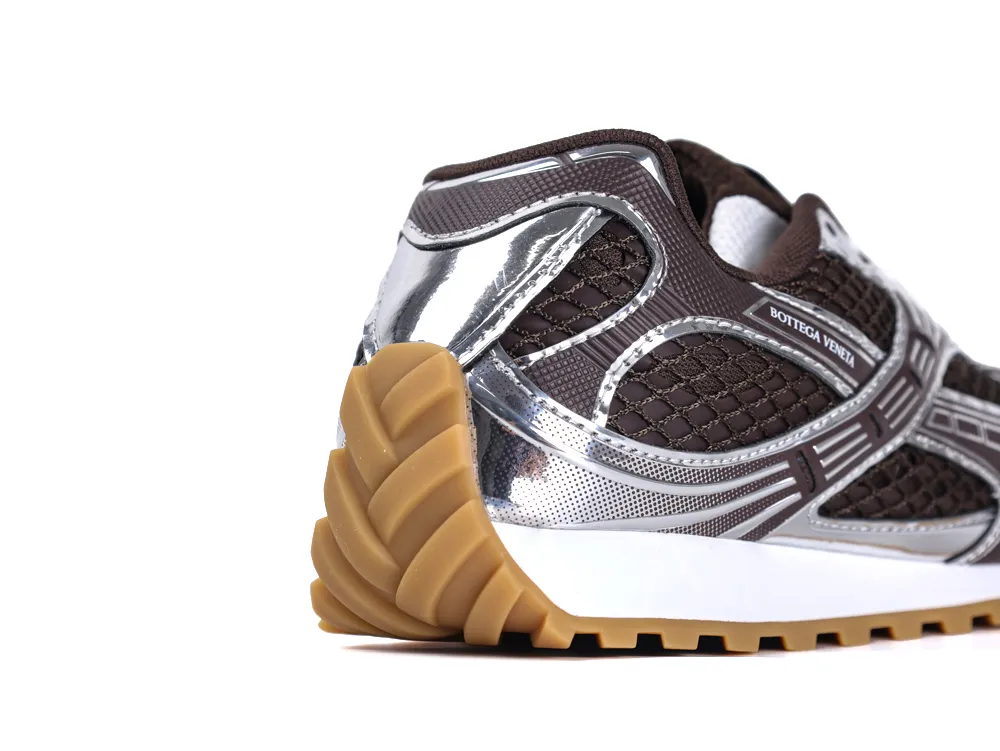 Brown mesh sneaker with silver accents and gum sole, showcasing side detail.