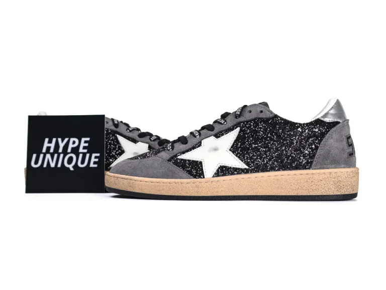 Side profile of Golden Goose Ball Star sneakers in black glitter and grey suede