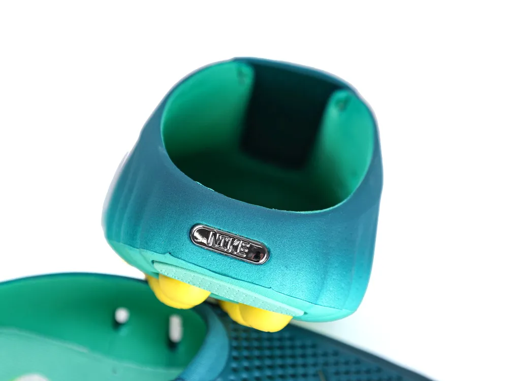 Rear view of Nike Mind 001 Geode Teal sneakers showing textured heel design
