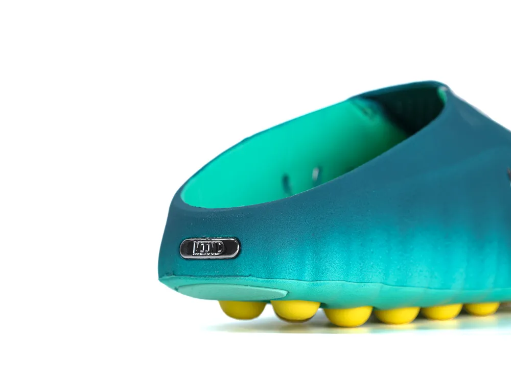 Heel view of Nike Mind 001 sneaker in Geode Teal and black