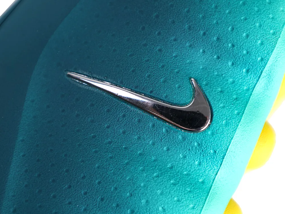 Close-up of Nike Swoosh logo on Geode Teal Mind 001 sneaker