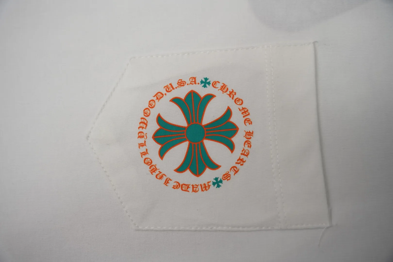Pocket with Orange Aqua Cross Logo
