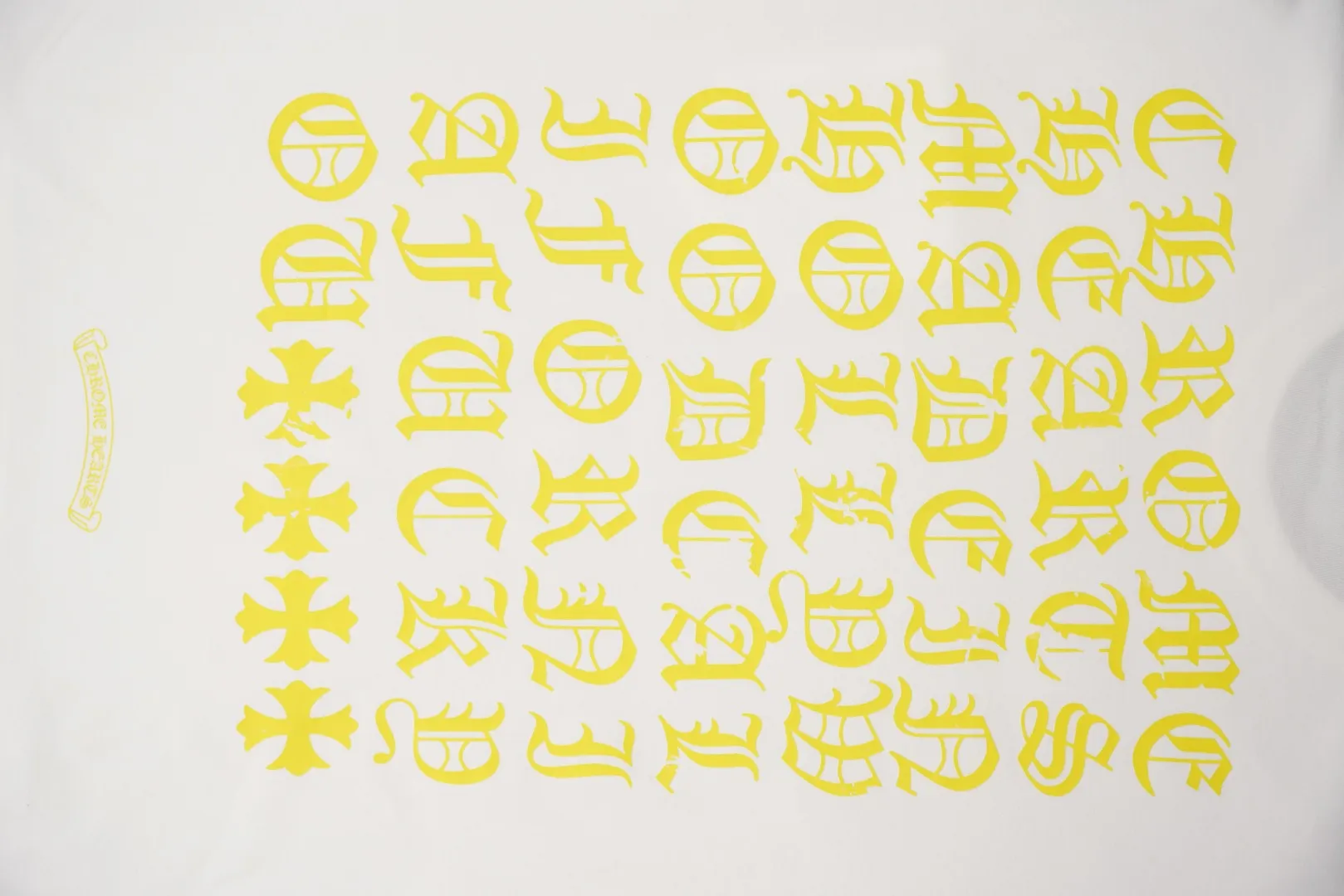 Yellow Gothic Letter Logo