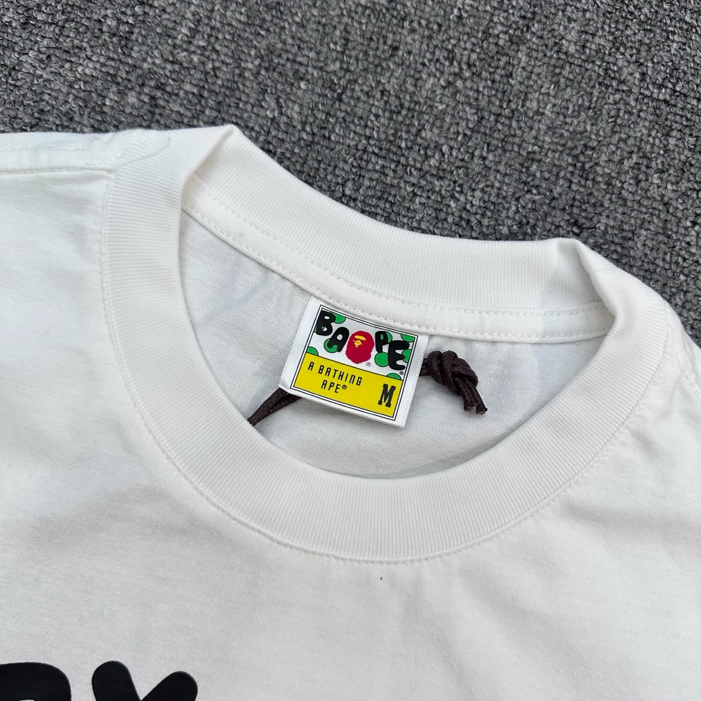 Neckline with visible Brand Tag and Label
