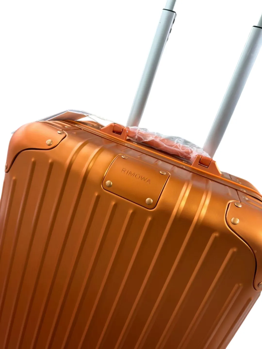Orange luggage logo detail