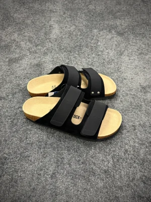 BK Uji Black Suede Double-Strap Sandals Angeled View