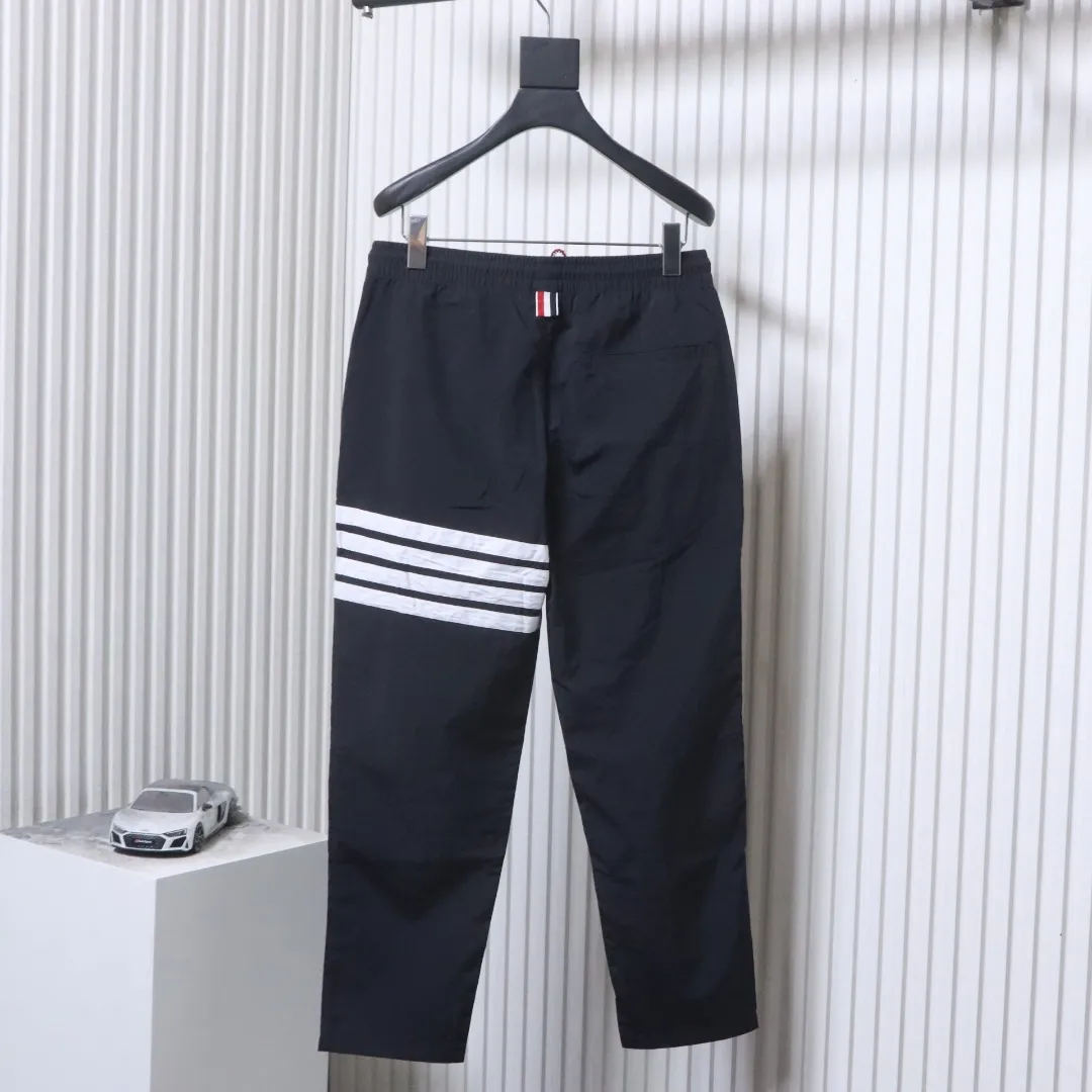 Back TB Four-Stripe Nylon Drawstring Pants