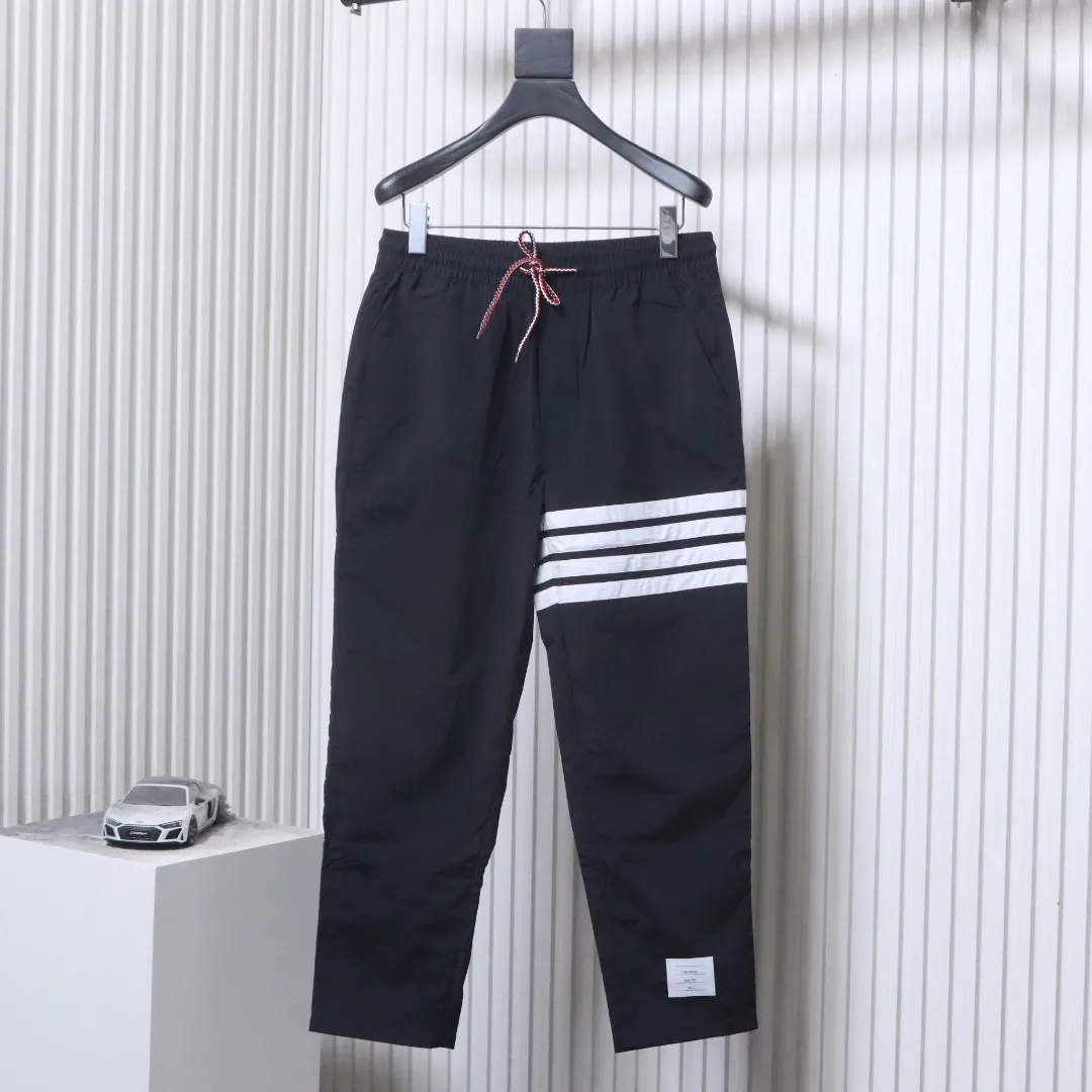 TB Four-Stripe Nylon Drawstring Pants