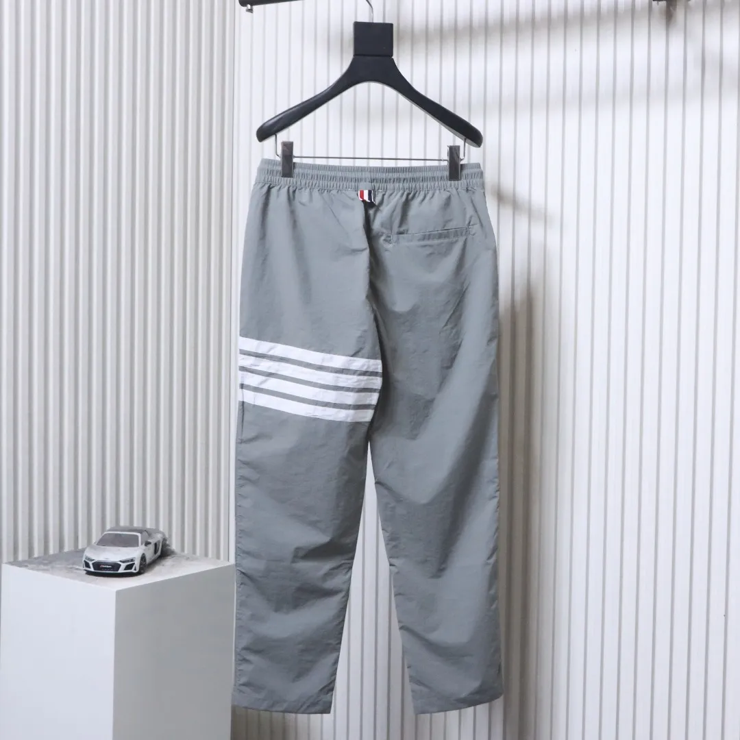 Back TB Four-Stripe Nylon Drawstring Pants