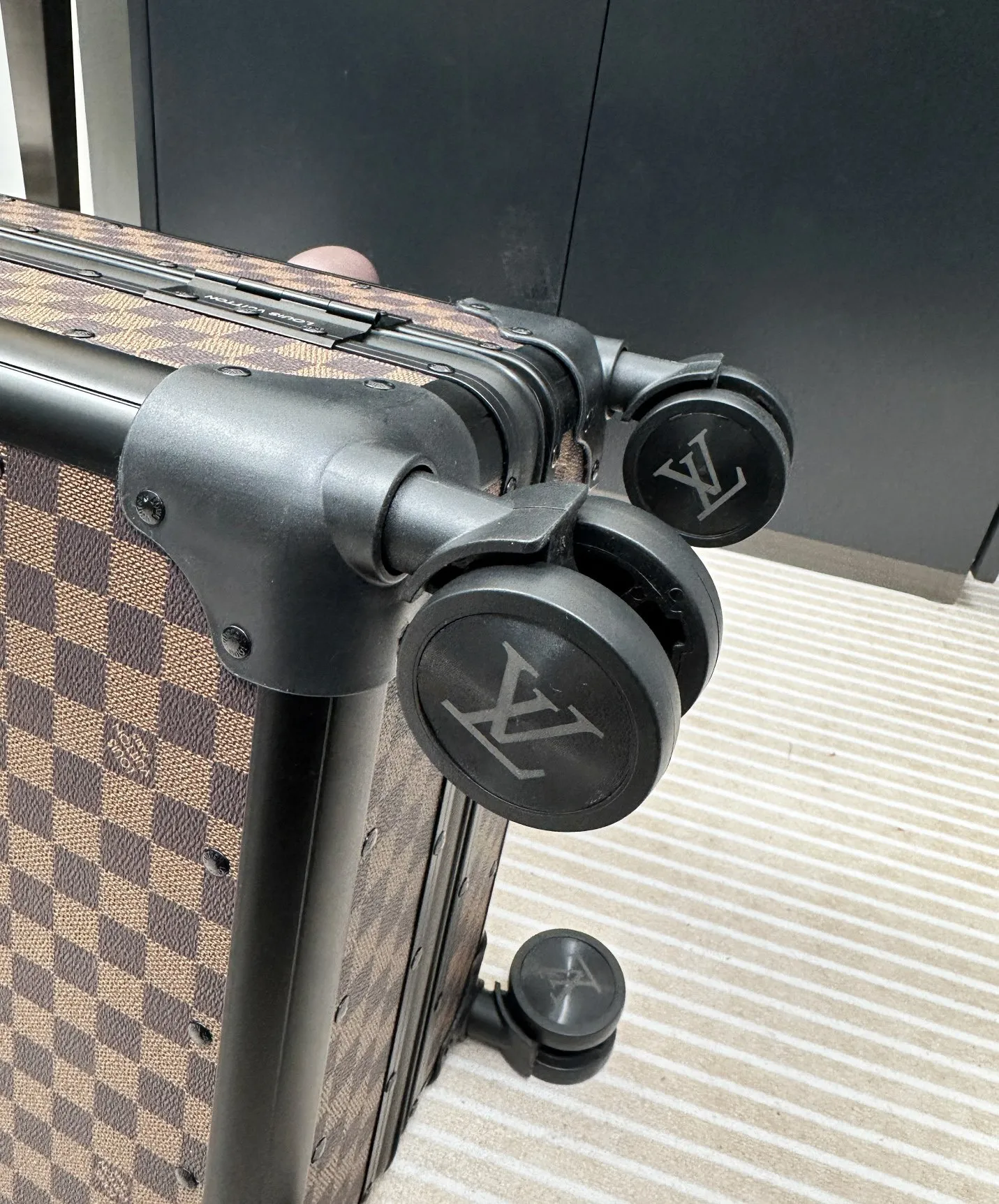 Damier Ebene luggage spinner wheel detail