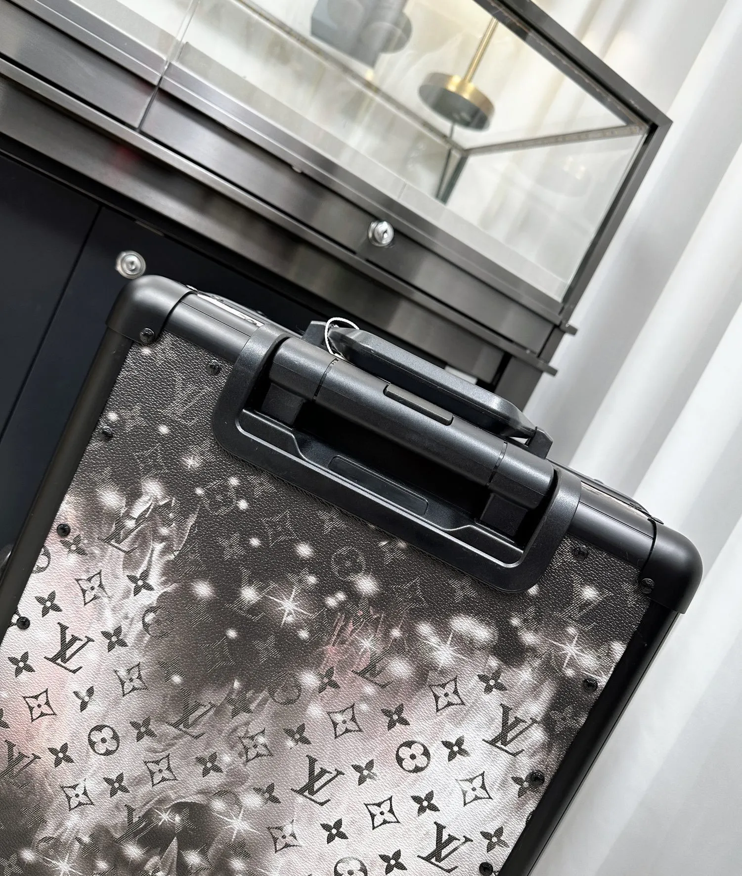 Galaxy monogram luggage top handle detail