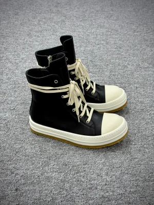 R 0wens Creep Leather High-Top Black Milk Sneakers Angeled View