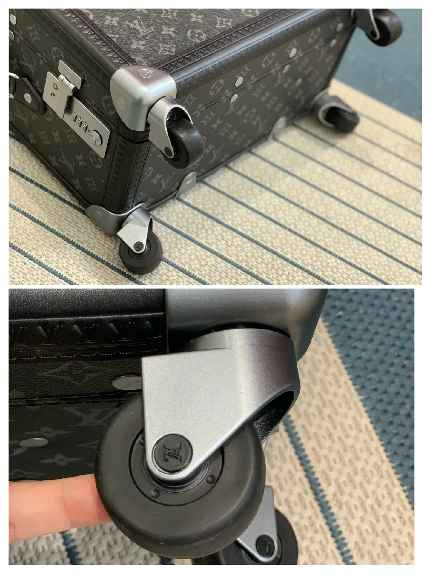 Black monogram rolling trunk wheel detail