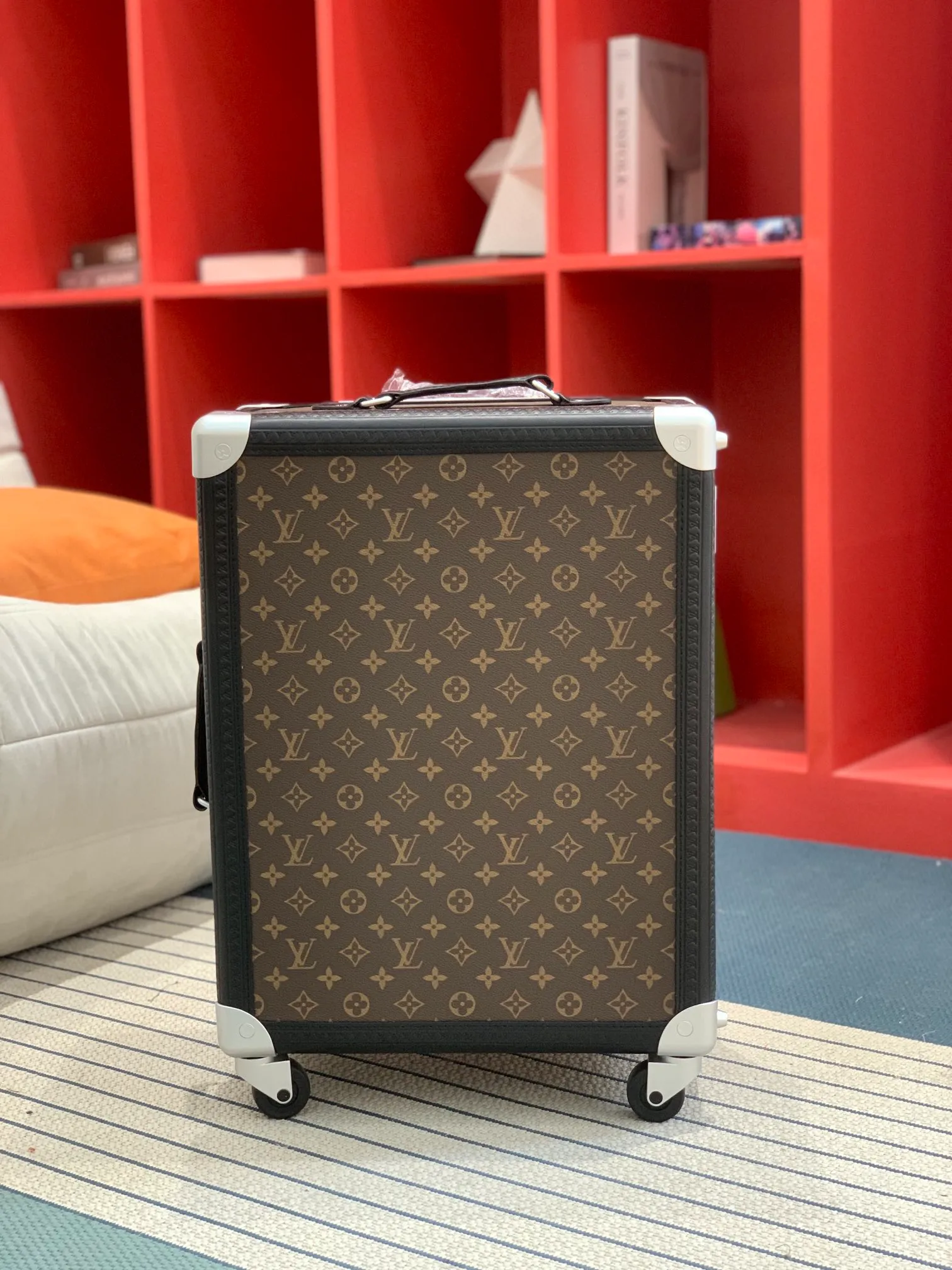Monogram rolling trunk front view