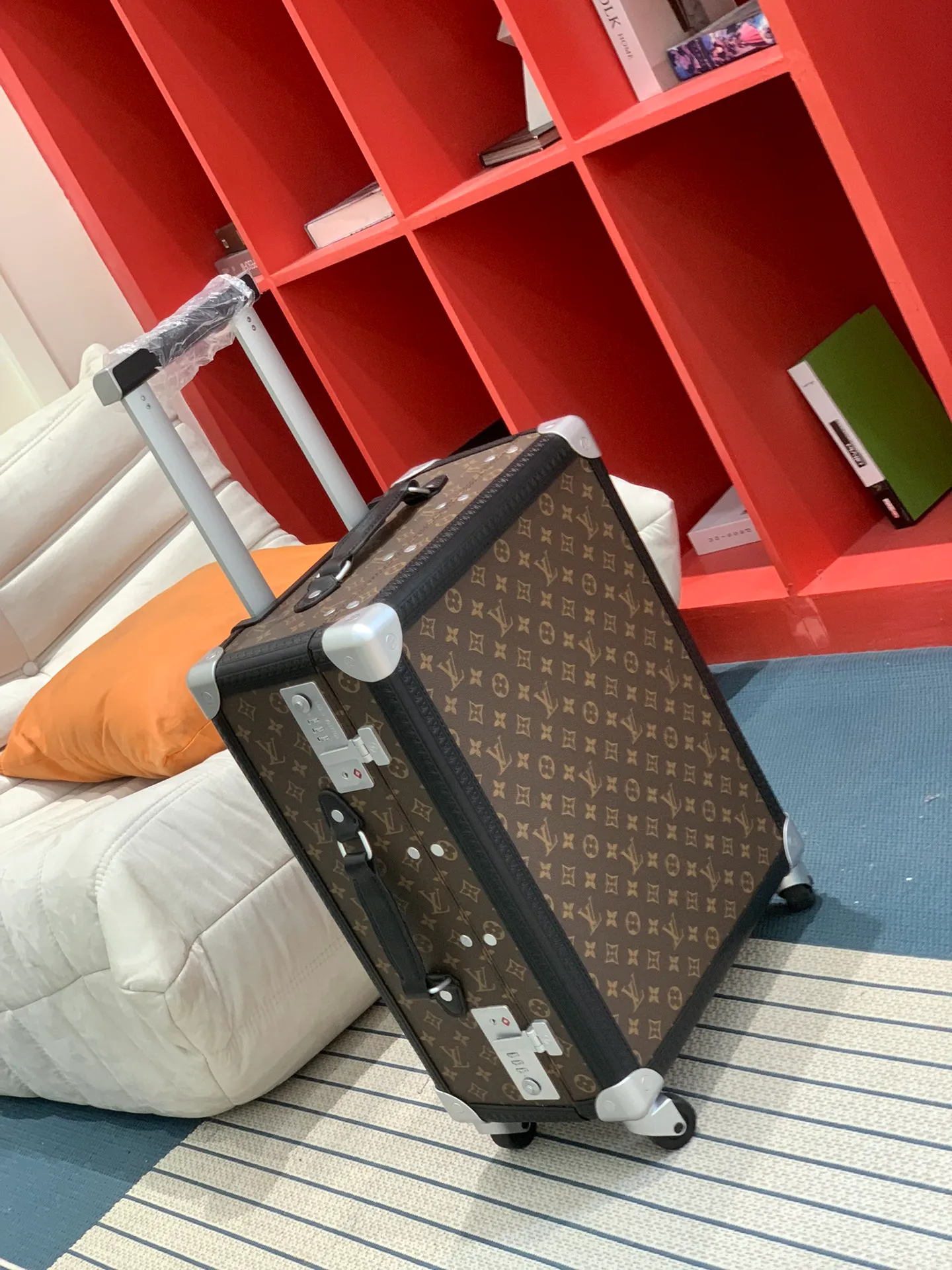 Monogram rolling trunk side view